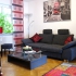 Wohndiele Mit Bequemer Couch, Stehleuchte, Großem Wandbild Und Weiterer Deko